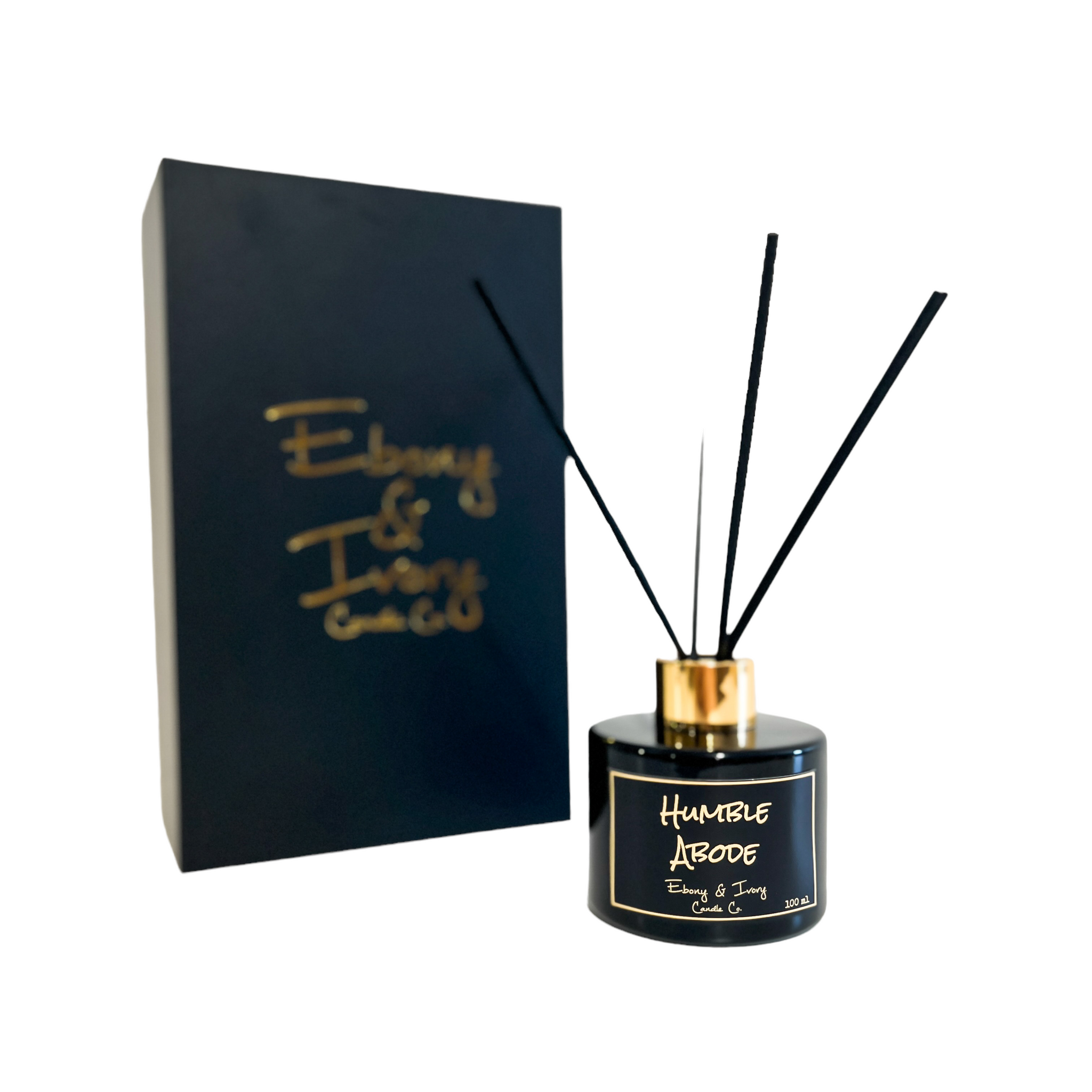 Black, one hundred milliliter, snickerdoodle, cupcake, vanilla, and brown sugar reed diffuser with a gold lid and a black label that reads Humble Abode