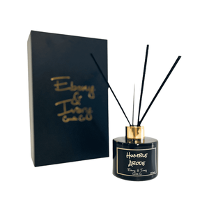 Black, one hundred milliliter, snicker doodles, vanilla, and brown sugar scented reed diffuser with a gold lid and a black label that reads Humble Abode
