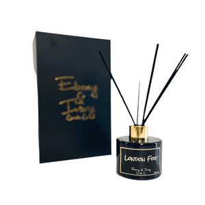 Black, one hundred milliliter, black tea, bergamot, and vanilla scented reed diffuser with a gold lid and a black label that reads London Fog