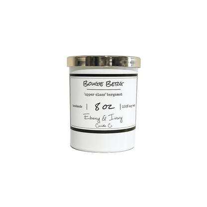 White, eight ounces, bergamot, sugared citrus, and sandalwood scented soy wax candle with a gold lid and a white label that reads Bougie Berg