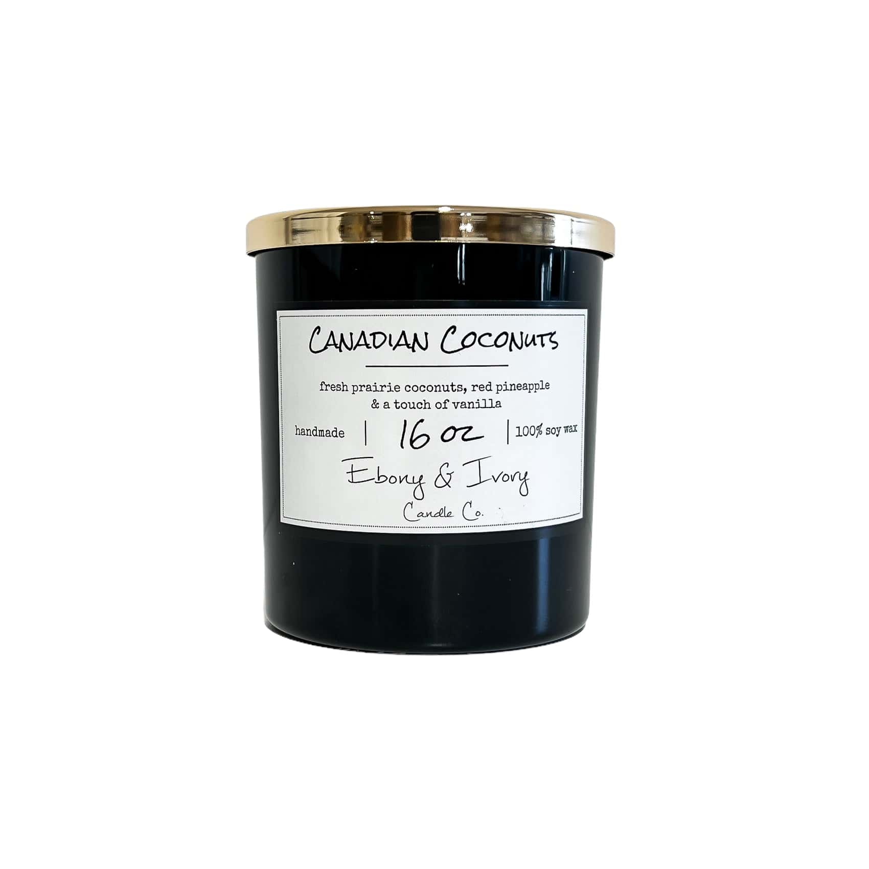 A black 16oz jar soy candle with a gold lid and a white label named Canadian Coconuts, on a white background, made by Ebony & Ivory Candle Co in Lethbridge, Alberta, Canada