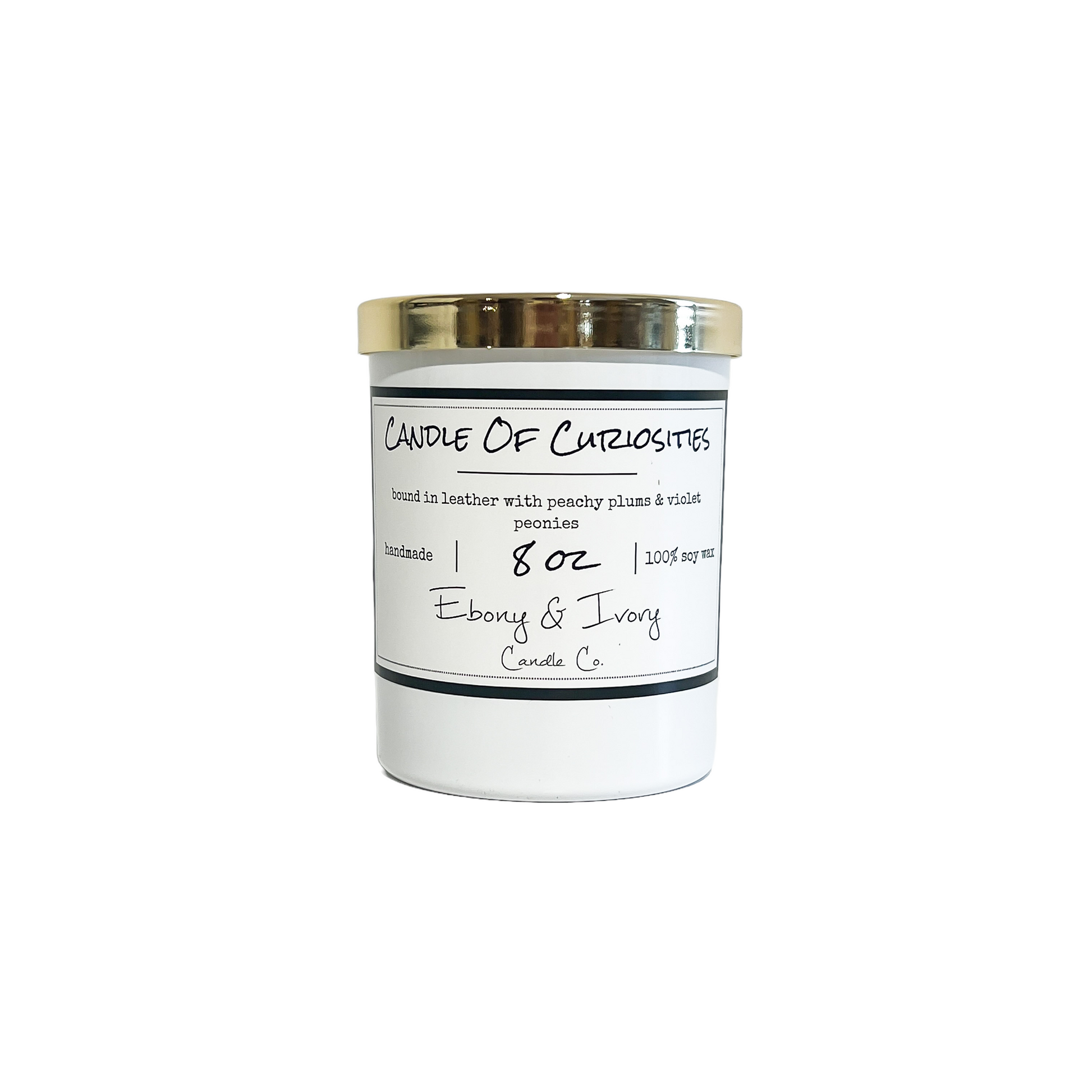 white, eight ounces, Leather, peaches, plums, violets, and peonies scented soy wax candle with a gold lid and a white label that reads Candle of Curiosity