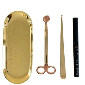Gold candle tray, gold wick trimmer, gold wick dipper, and black usb chargeable electric lighter from ebony and ivory candle co