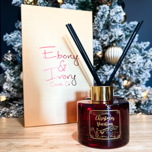 Red, one hundred milliliter, egg nog scented reed diffuser with a gold lid and label