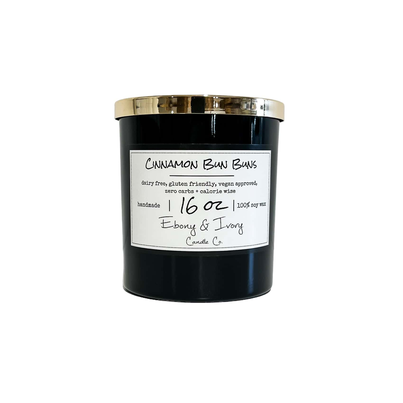 Black, sixteen ounces, cinnamon roll scented soy wax candle with a gold lid and a white label that reads Cinnamon Bun Buns