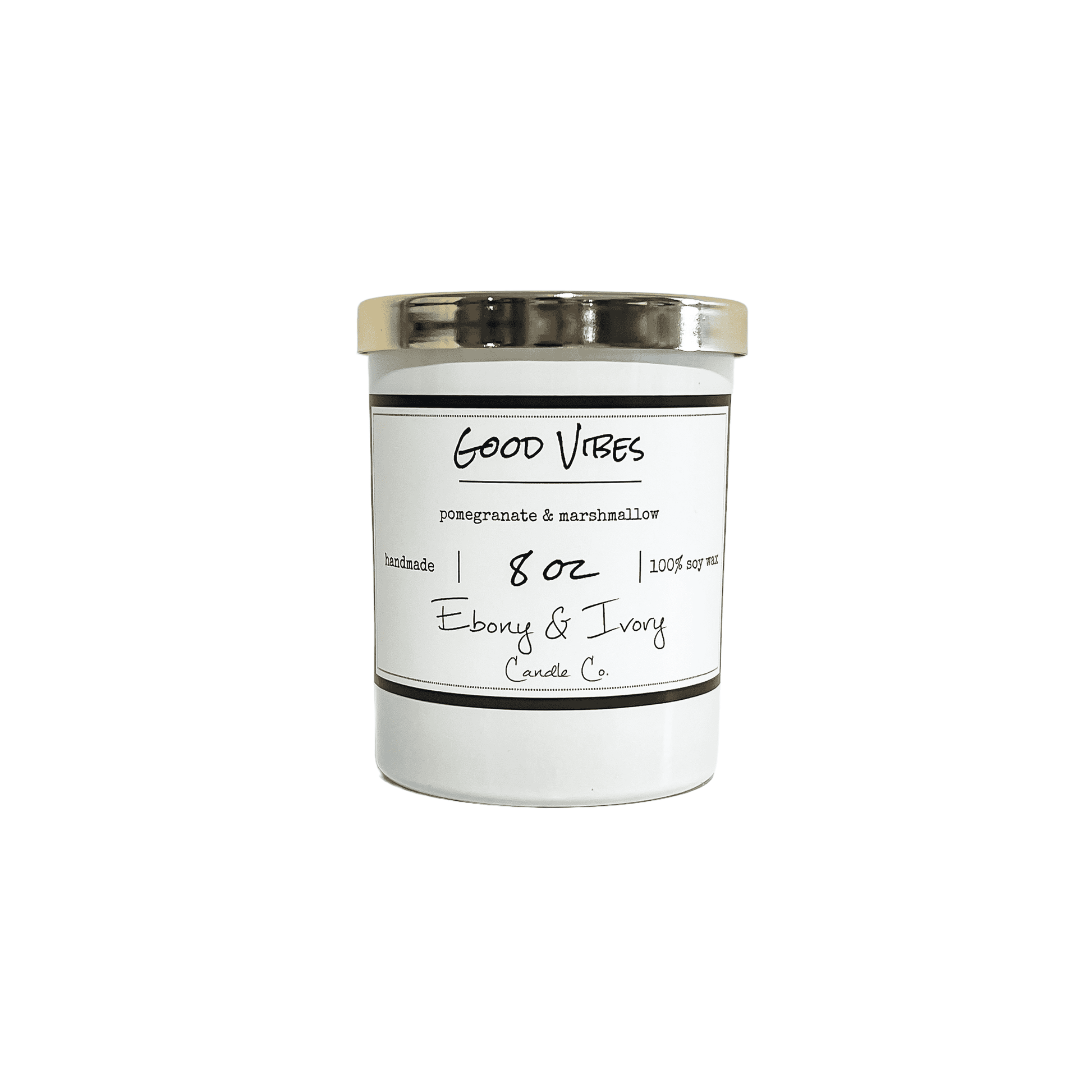 White, eight ounce, Pomegranate and Marshmallow scented soy wax candle with a gold lid and a white label that reads Good Vibes