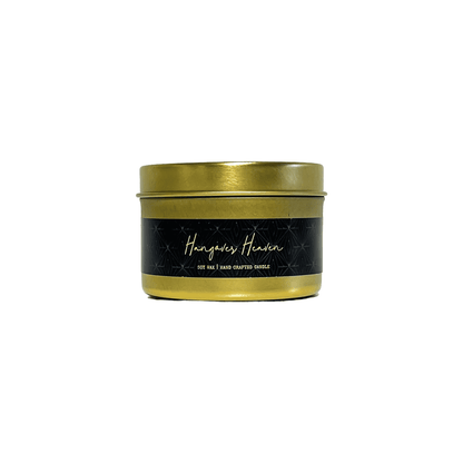 A gold 4oz tin soy candle with a black label named Hangover Heaven, on a white background, made by Ebony & Ivory Candle Co in Lethbridge, Alberta, Canada
