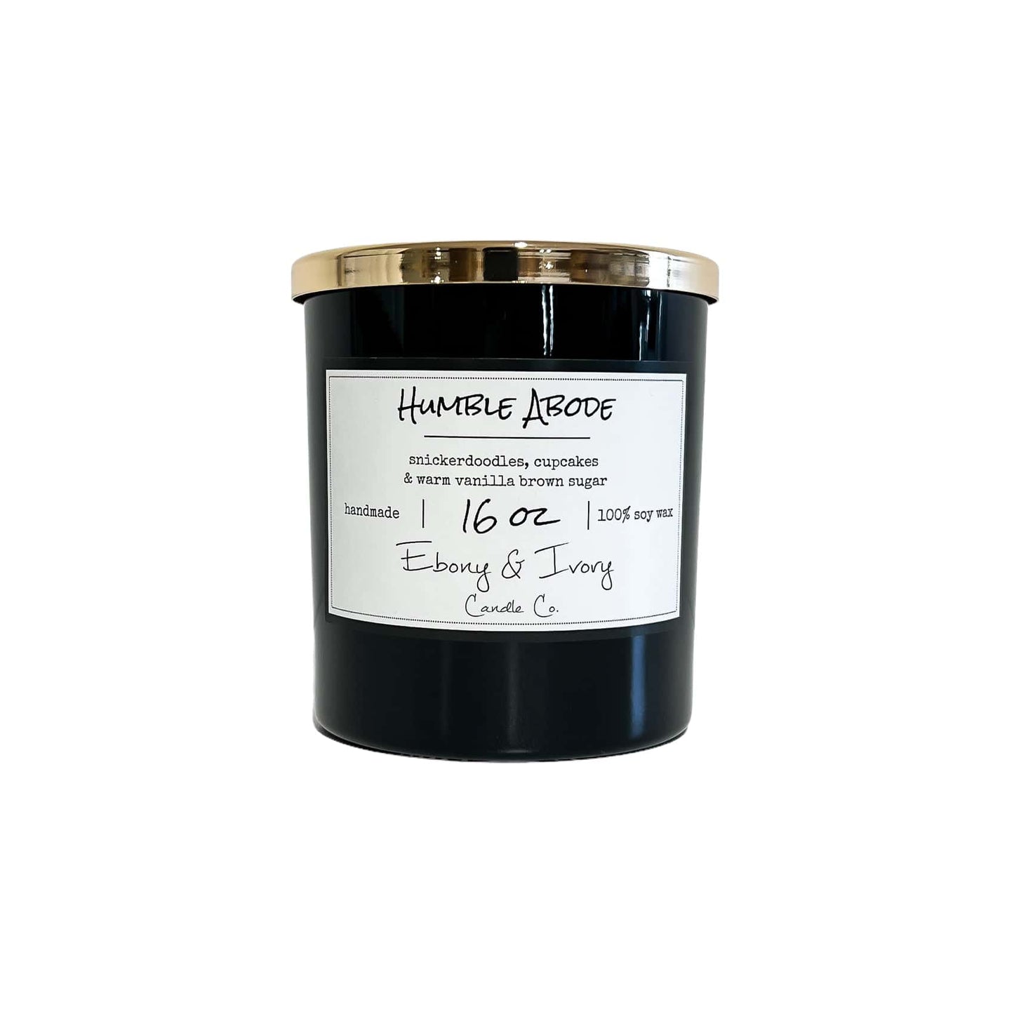 A black 16oz jar soy candle with a gold lid and a white label named Humble Abode, on a white background, made by Ebony & Ivory Candle Co in Lethbridge, Alberta, Canada