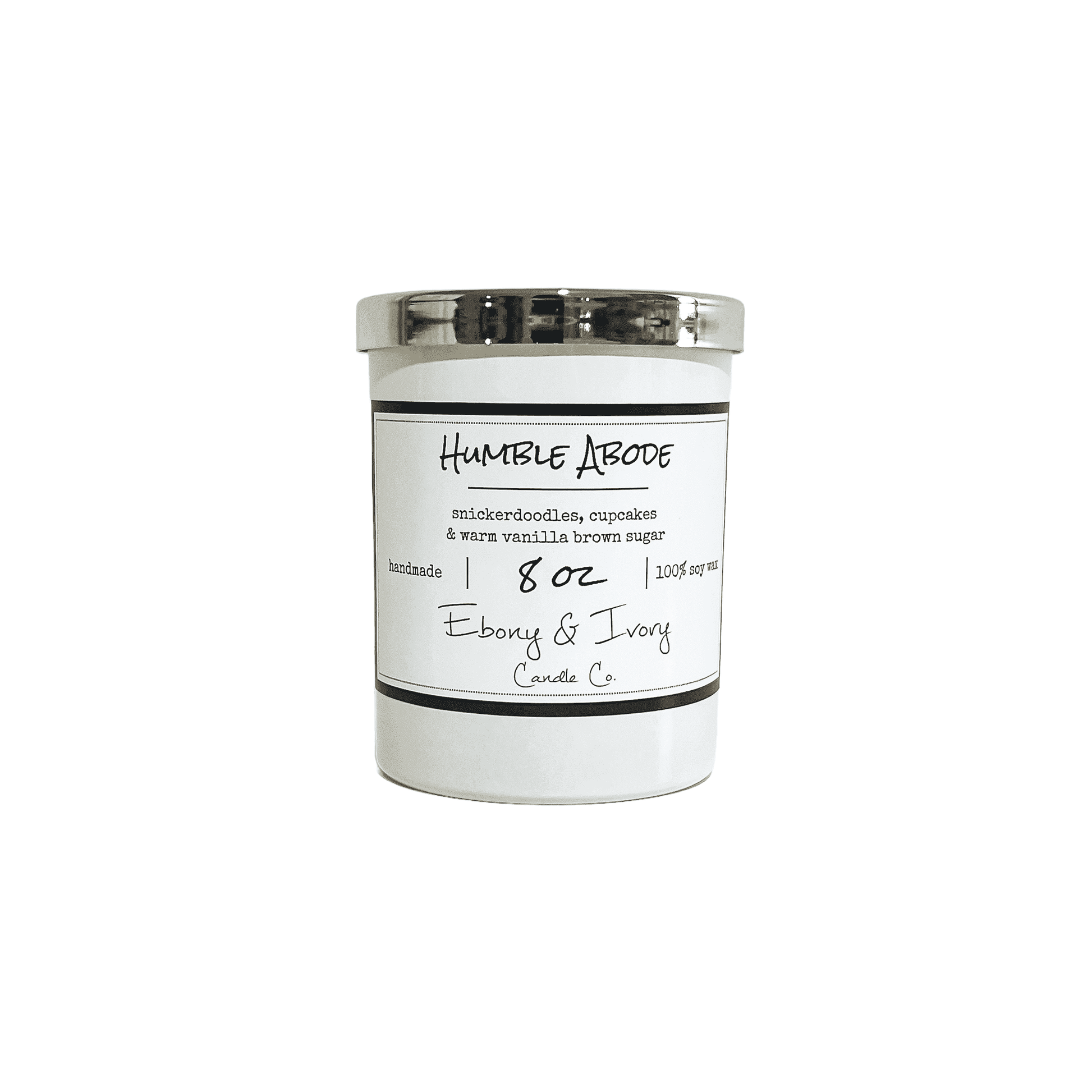 A white 8oz jar soy candle with a gold lid and a white label named Humble Abode, on a white background, made by Ebony & Ivory Candle Co in Lethbridge, Alberta, Canada