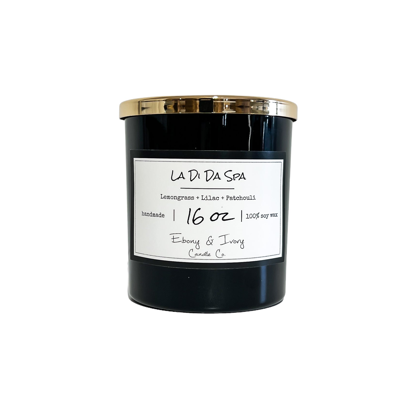 Black, sixteen ounce, lemongrass, lilac, and patchouli scented soy wax candle with a gold lid and a white label that reads La Di Da Spa