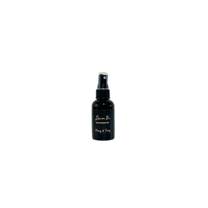 black two fluid ounces, Lavender, vanilla, and jasmine  scented fragrance body and room spray with a black label that reads Dream On