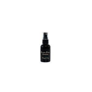 Black, two fluid ounce, white tea, ginger, peach, and chardonnay scented fragrance spray with a black label that reads Hangover Heaven