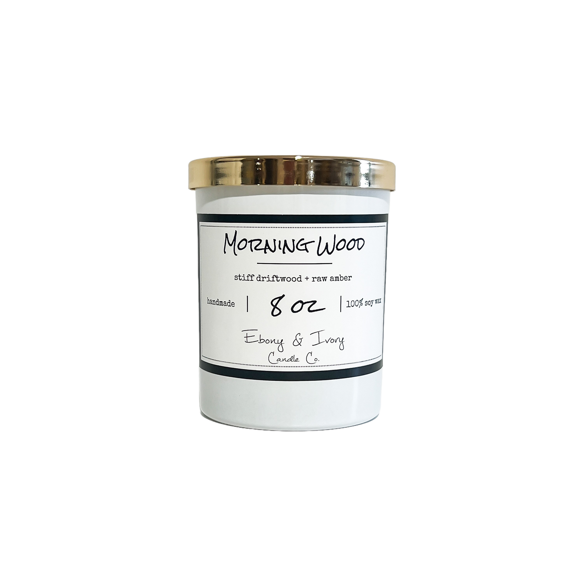 White, eight ounce, driftwood and amber scented soy wax candle with a gold lid and a white label that reads Morning Wood