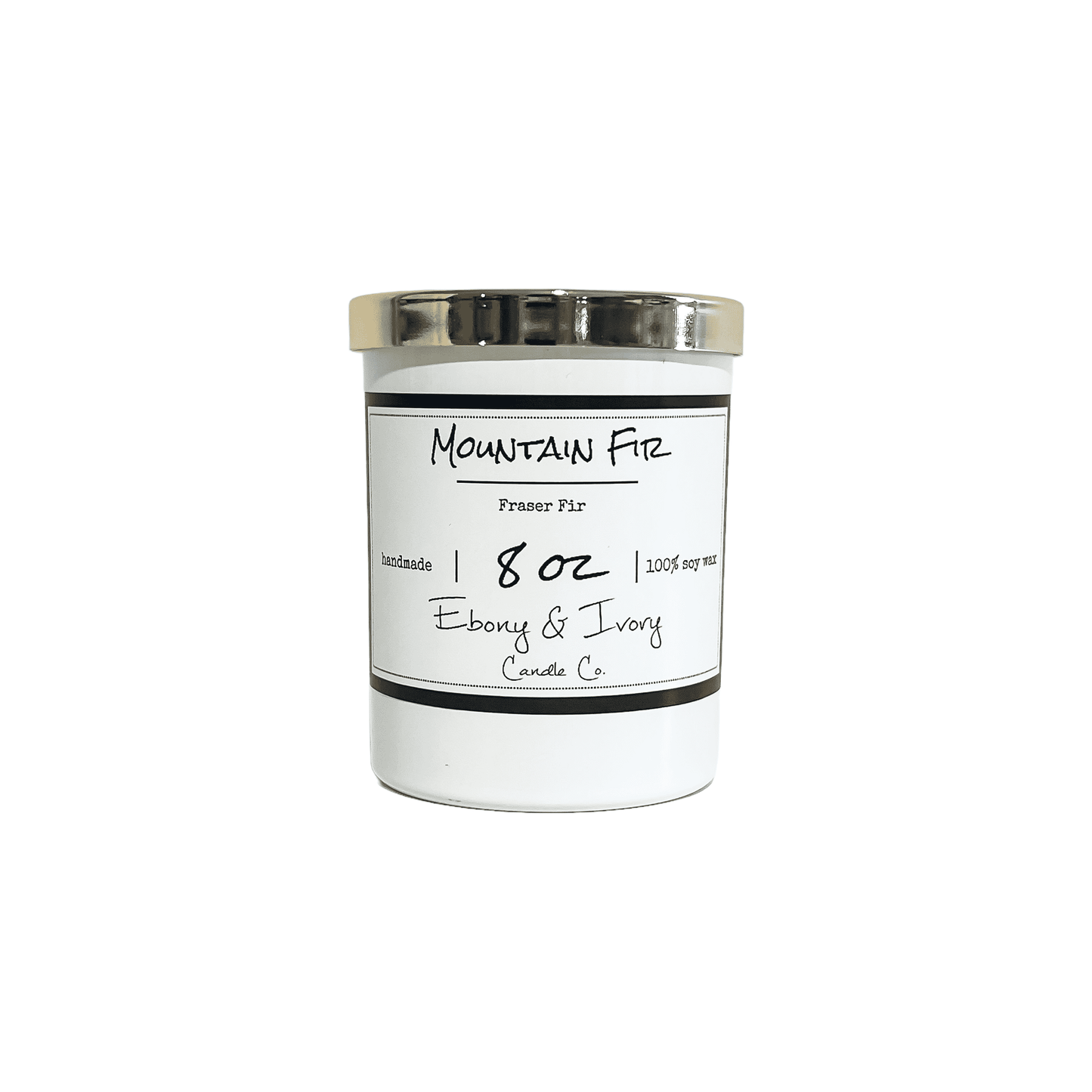 A white jar 8oz soy candle with a gold lid and a white label named Mountain Fir, on a white background, made by Ebony & Ivory Candle Co in Lethbridge, Alberta, Canada