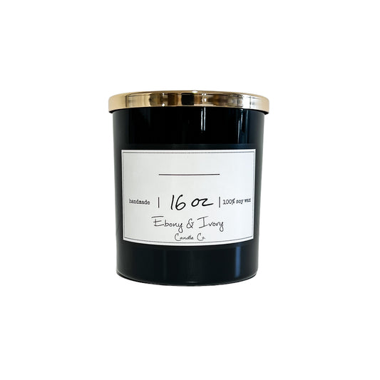 16 ounce candle, in a black jar with a gold lid. Has a white label with black text on the front. made with soy wax, cotton wicks, and smells like sugared almonds