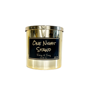 Gold, sixty four ounce, mahogany and apples scented soy wax candle with a gold lid and a black label that reads One Night Stand