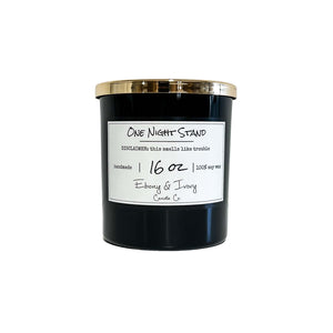 Black, sixteen ounce, mahogany and apples scented soy wax candle with a gold lid and a white label that reads One Night Stand