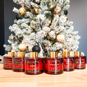 Ebony and Ivory Candle Co's red holiday christmas reed diffusers