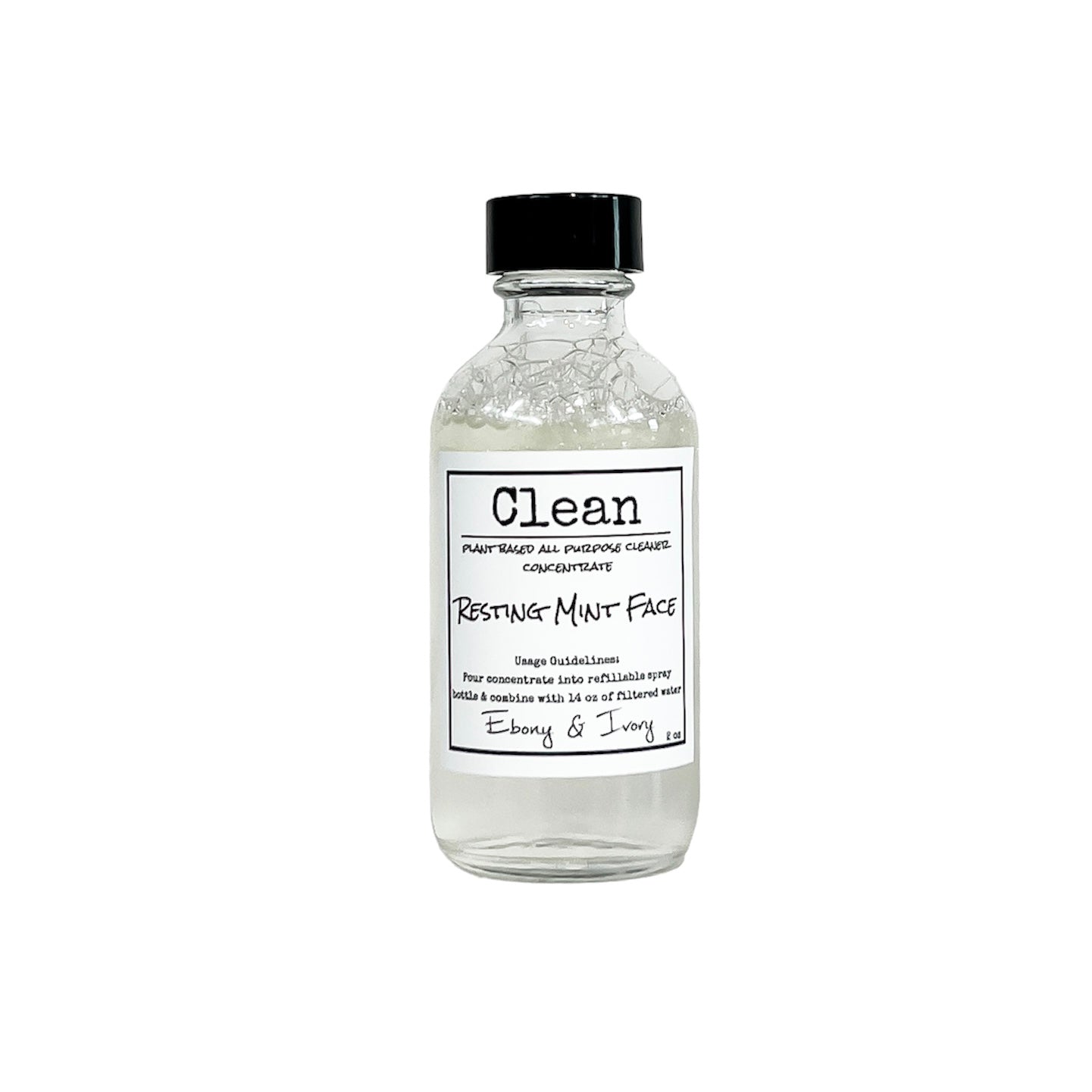 Clear two ounce bottle of mint and rosemary scented all purpose cleaner refill concentrate with a white label that reads Resting Mint Face