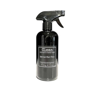 Black spray bottle of mint and rosemary scented all purpose cleaner with a black label that reads Resting Mint Face