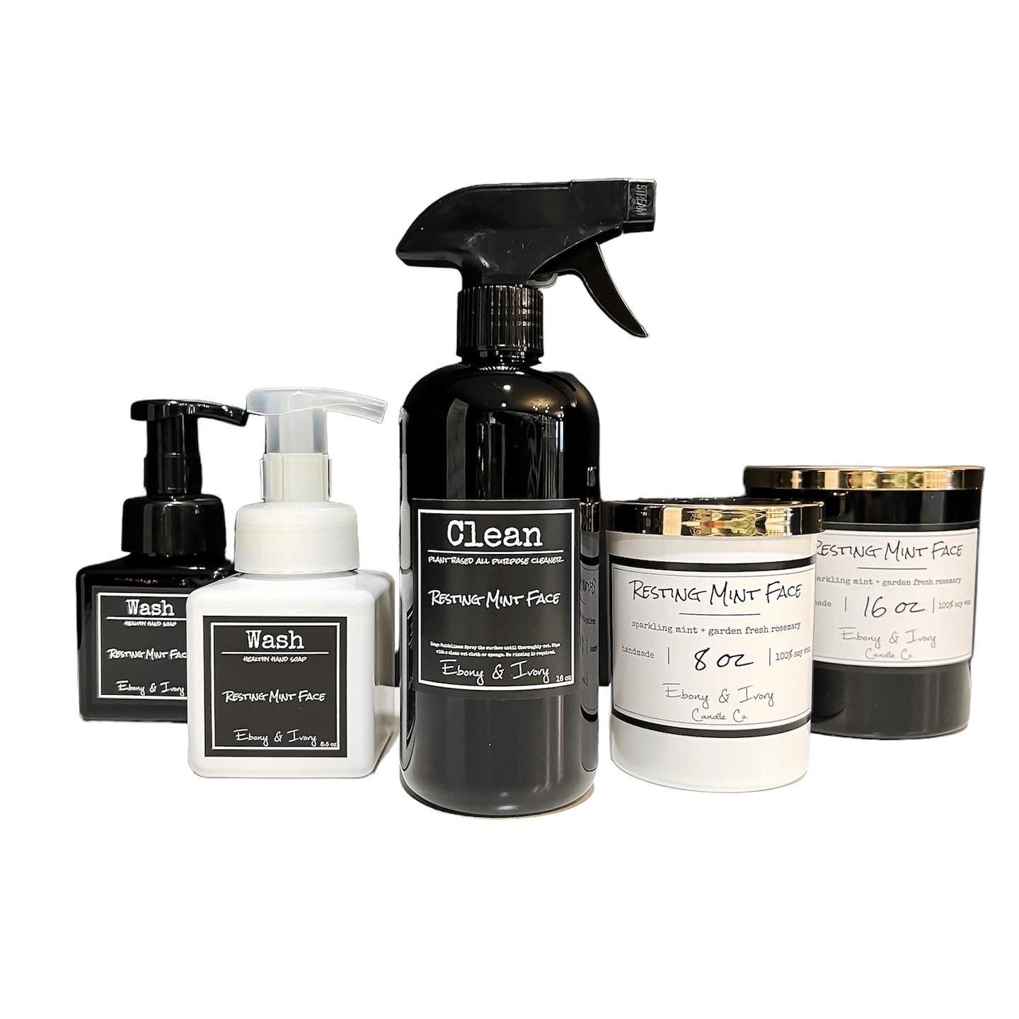 Resting Mint Face home collection has a black foaming hand soap, a white foaming hand soap, a black spray bottle of all purpose cleaner, a white eight ounce soy wax candle, and a black sixteen ounce soy wax candle. All scented with mint and Rosemary