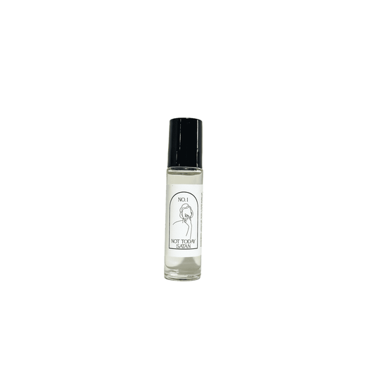 A clear 10ml argan oil roll on, with a black lid and a white label named Not Today Satan, on a white background, made by Ebony & Ivory Candle Co in Lethbridge, Alberta, Canada