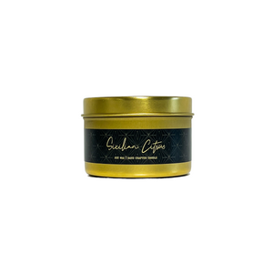 Gold, four ounce tin, soy wax candle with black label that reads Sicilian Citrus