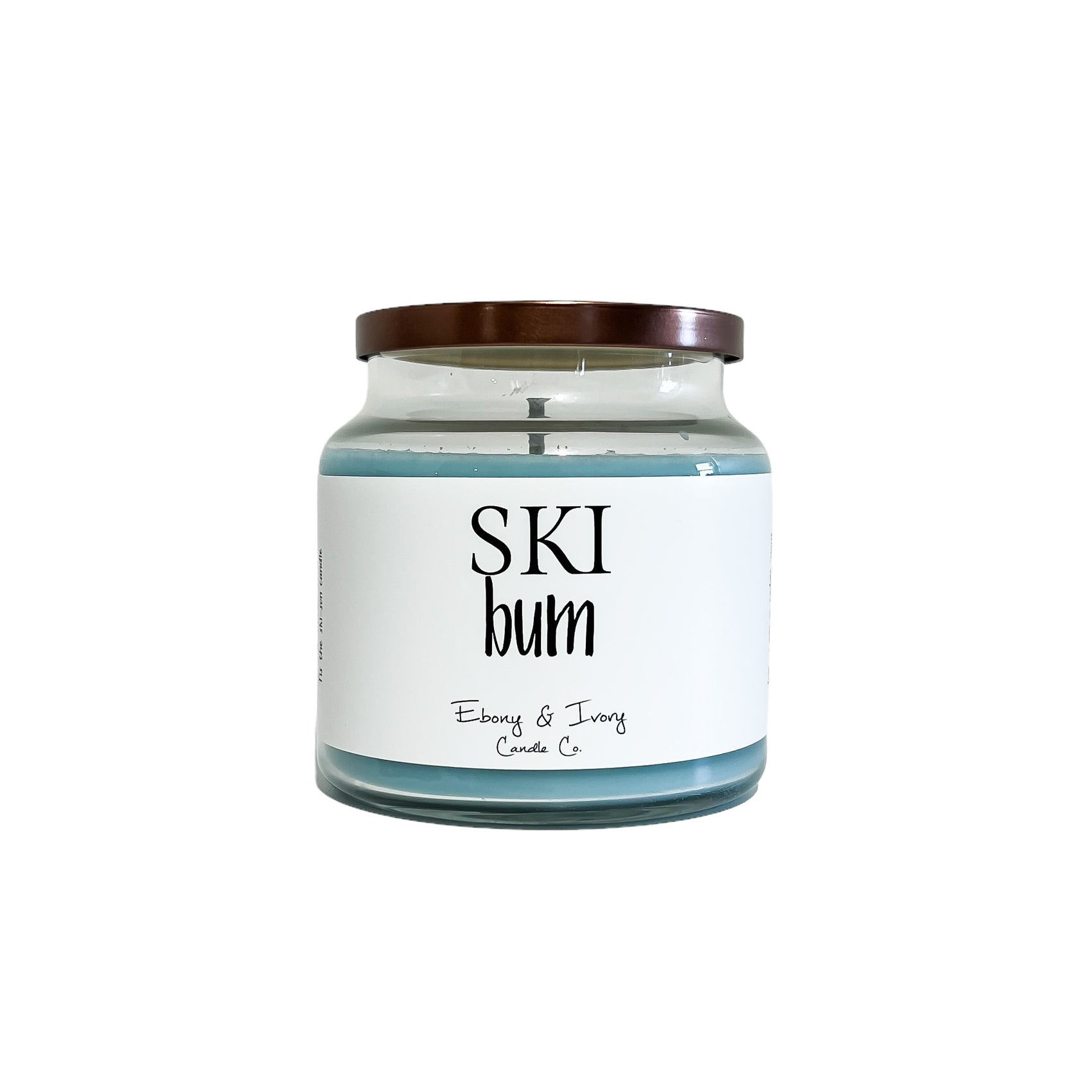 clear glass, sixteen ounce, peppermint and vanilla scented, blue coloured soy wax candle with a bronze lid and a white label that reads Ski Bum