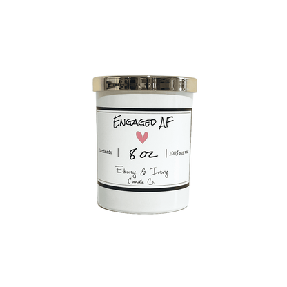 A white jar 8oz soy candle with a gold lid and a white label named Engaged AF, on a white background, made by Ebony & Ivory Candle Co in Lethbridge, Alberta, Canada