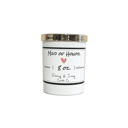 A white jar 8oz soy candle with a gold lid and a white label named Maid of Honor, on a white background, made by Ebony & Ivory Candle Co in Lethbridge, Alberta, Canada