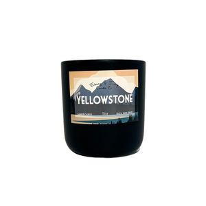 Black, eleven ounce, leather and bergamot scented soy wax candle labeled Yellowstone