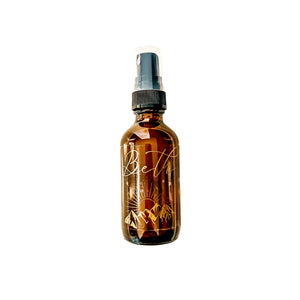 Amber, two fluid ounce, cherry, cedar wood, and amber scented fragrance spray labeled Beth in gold letters